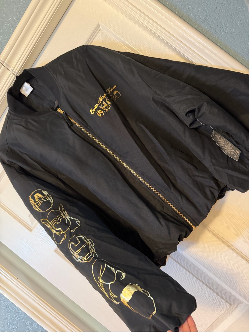 BRAND NEW with tags . Black is Puffer Jacket with Gold Marvel print XL size
